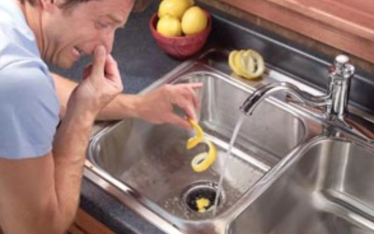 The cause of the smell of sewage from the sink